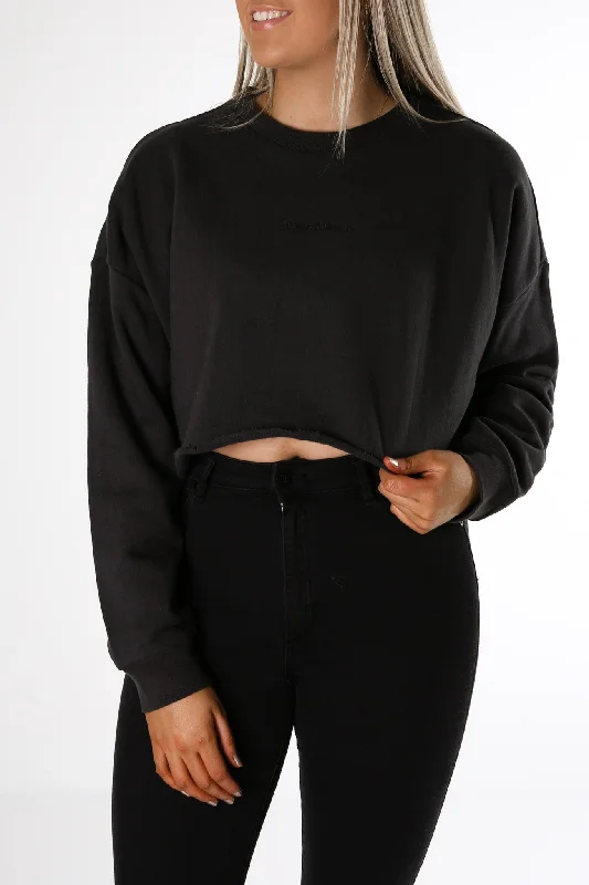 A Cropped Oversized Sweater Washed Black Zippered Front Buttoned Front Snap Front